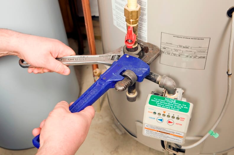 Plumber repairing a water heater valve in Jacksonville Beach